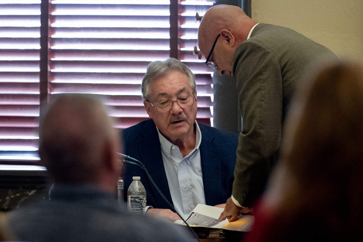 Philip Moran, left, speaks Thursday with his attorney H.H. “Tracy” Klein.
