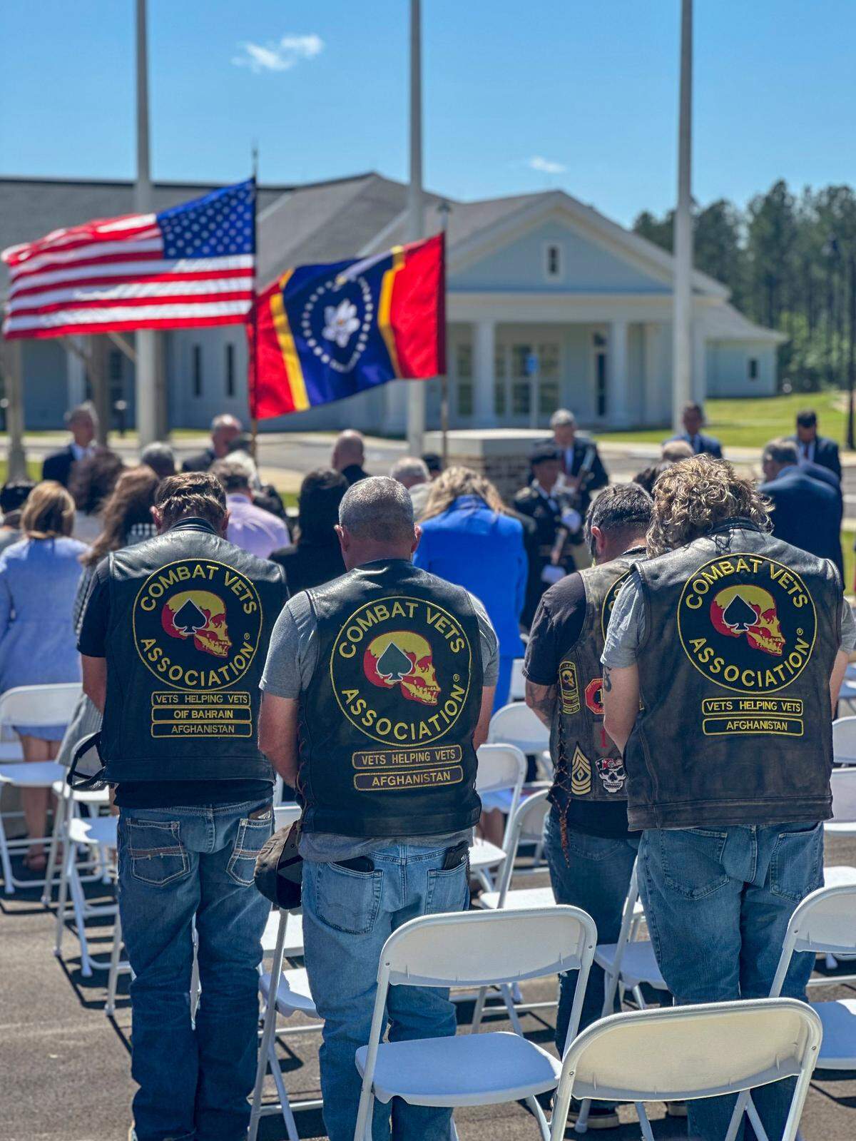 Members of the Combat Veterans Motorcycle Association, Gulf Coast Chapter 44-1, attend the opening ceremony. The group helped fund outdoor amenities and pledged long-term support for the home.
