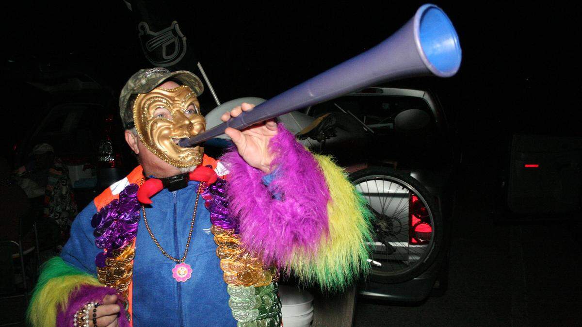 SHANNON DAVIDSON/SPECIAL TO THE SUN HERALD 
 John McCord from Fort Worth, Texas, shows off his costume at the Ocean Springs Carnival Association night parade Friday, Feb. 5, 2016, in downtown Ocean Springs.