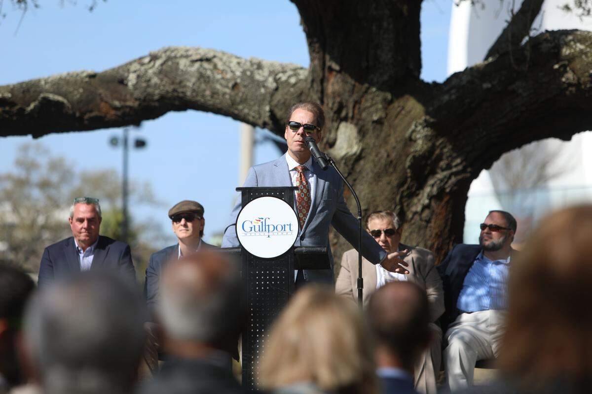 Gulfport Mayor Billy Hewes speaks at the groundbreaking of a new tram bridge that will cross over U.S. 90 and connect Jones Park to the Mississippi Aquarium on March 21, 2022.