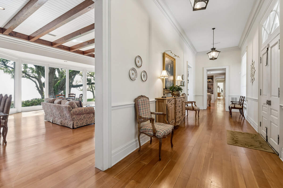 Pristine oak floors are shown in this Acadian-style home on the Ocean Springs waterfront. Ample windows overlook the Mississippi Sound.