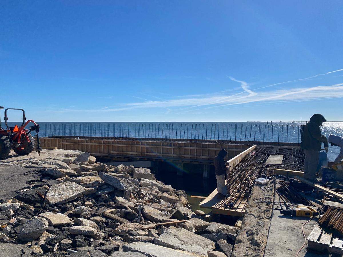 Contractors for Long Beach worked on Friday Dec. 6, 2024 to build walls around the harbor to protect the structure from damaging wave action during hurricanes and tropical storms.