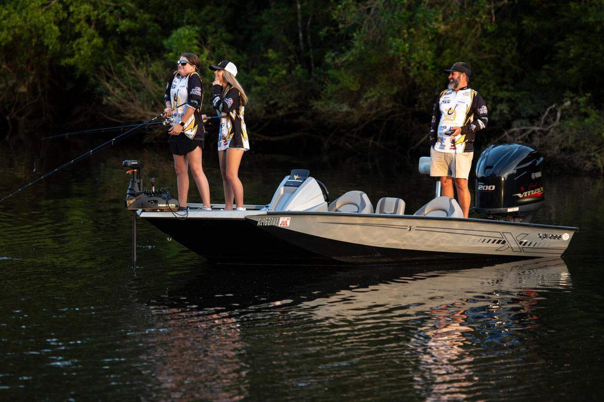 D’Iberville Bass Fishing Team members Olivia King and Harper Krohn fish on the Tchoutacabouffa River in D’Iberville with their Coach Hiram King on Monday, June 3, 2024.