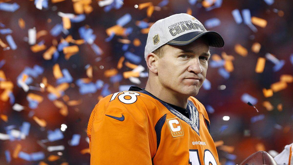 Denver Broncos quarterback Peyton Manning watches the AFC championship trophy presentation following the NFL football AFC Championship game between the Denver Broncos and the New England Patriots, Sunday, Jan. 24, 2016, in Denver. The Broncos defeated the Patriots 20-18 to advance to the Super Bowl. (AP Photo/Joe Mahoney)