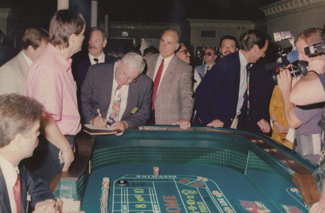 This picture taken August 1, 1992, shows Tommy Gollott prepares for the first legal “roll of the dice” in Mississippi and the Isle of Capri Biloxi. On the left you can barely see Bruce Nourse who was an agent with the Gaming Commission, Ed Ernst, president of the Isle, Bernie Goldstein, chairman and CEO of the Isle, Tommy Gollott, Mayor Pete Halet and various Isle executives in the back.