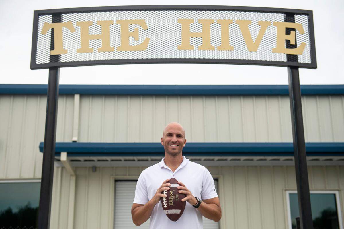 St. Martin football coach Ty Smith poses in front of the football locker rooms at Joe Barlow Stadium in St. Martin on Wednesday, July 13, 2022.