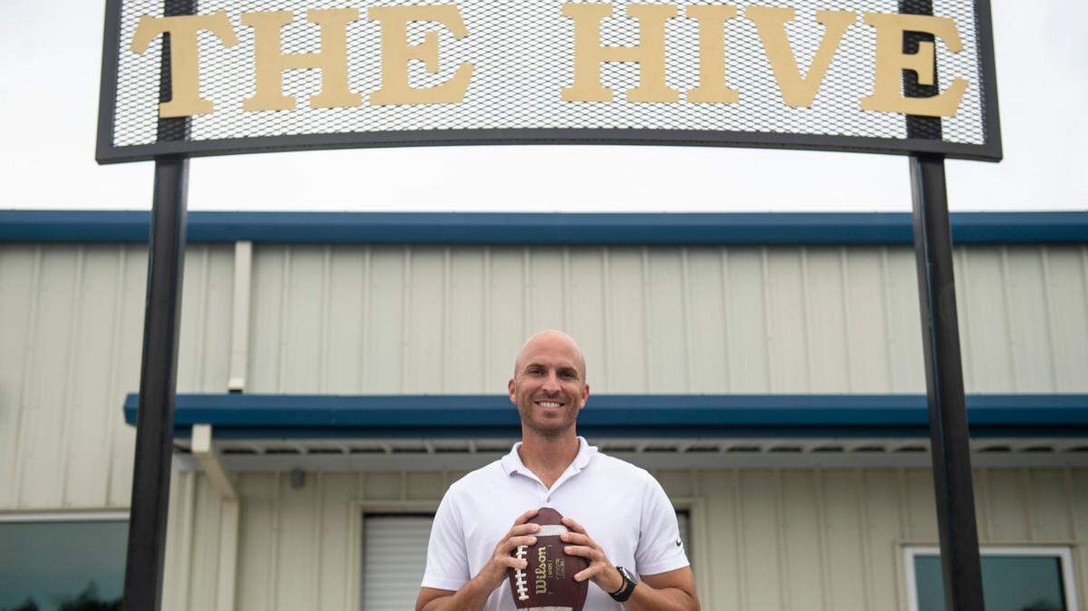 St. Martin football coach Ty Smith poses in front of the football locker rooms at Joe Barlow Stadium in St. Martin on Wednesday, July 13, 2022.