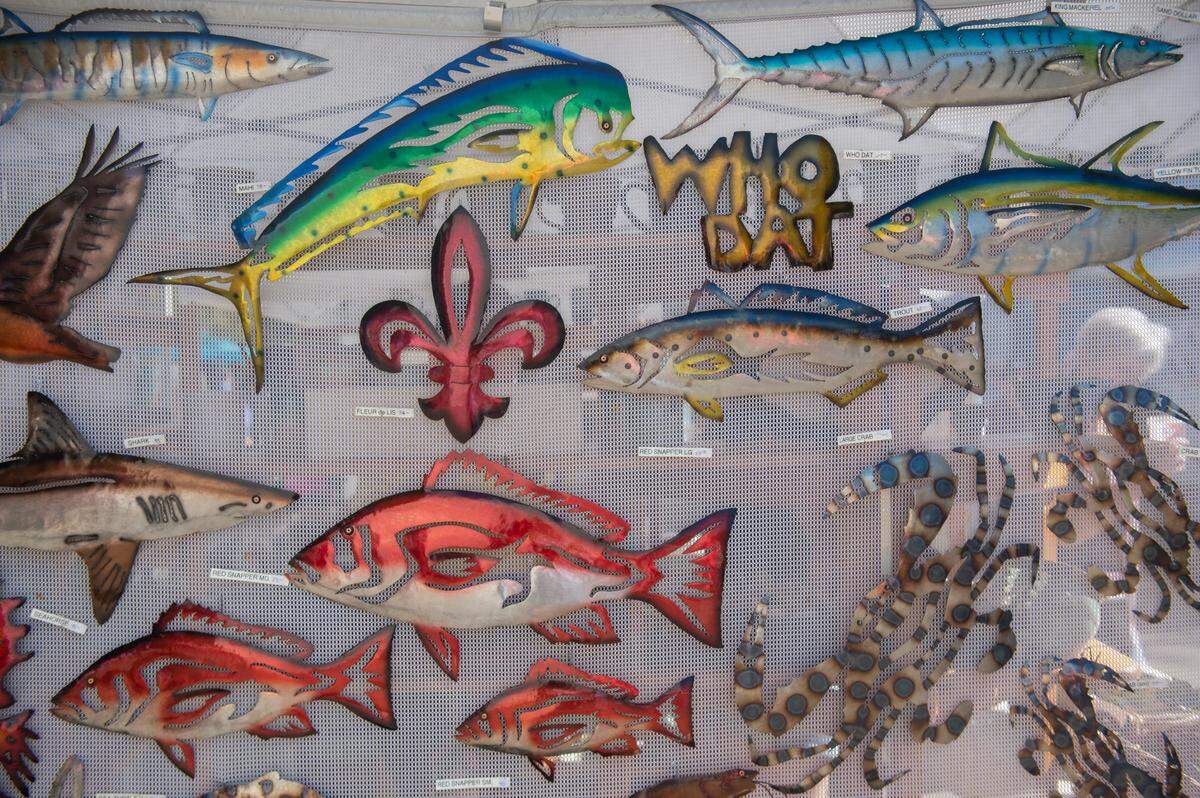 Metal signs for sale during the Peter Anderson Festival in Ocean Springs on Sunday, Nov. 6, 2022.
