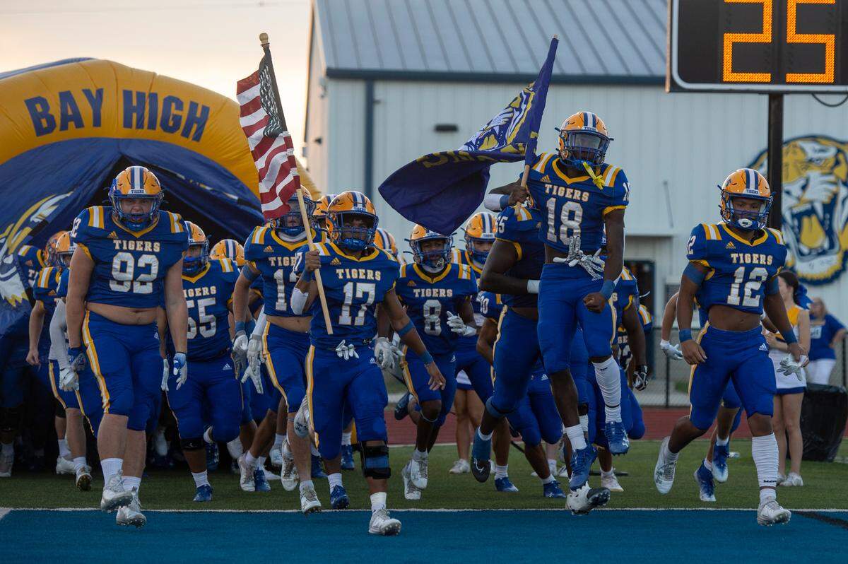 The Bay High Tigers football team takes the field at Bay High in Bay St. Louis on Friday, Sept. 1, 2023.