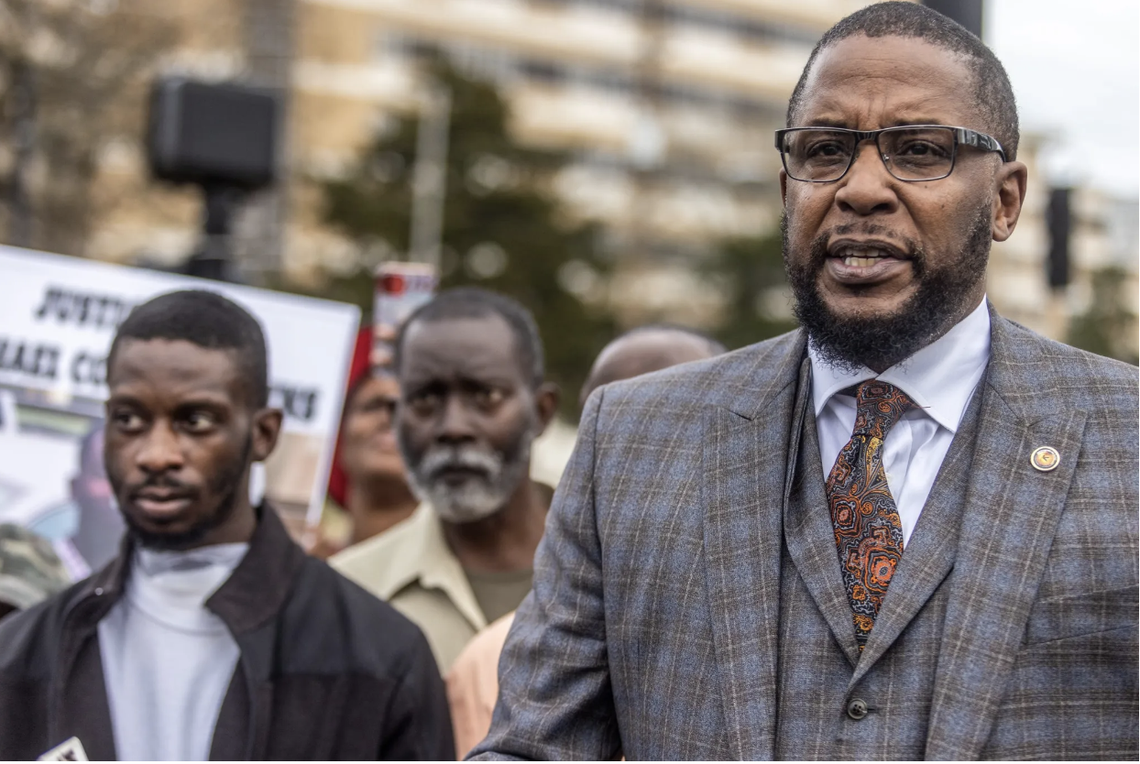Attorney Malik Zulu Shabazz, right, representing Michael Jenkins, far left, and Terrell Parker speaks to media near the University of Mississippi Medical Center in Jackson, Miss., Wednesday, February 15, 2023. Shabazz claims that his clients were assaulted by Rankin County sheriff deputies, which left Jenkins with serious injuries.