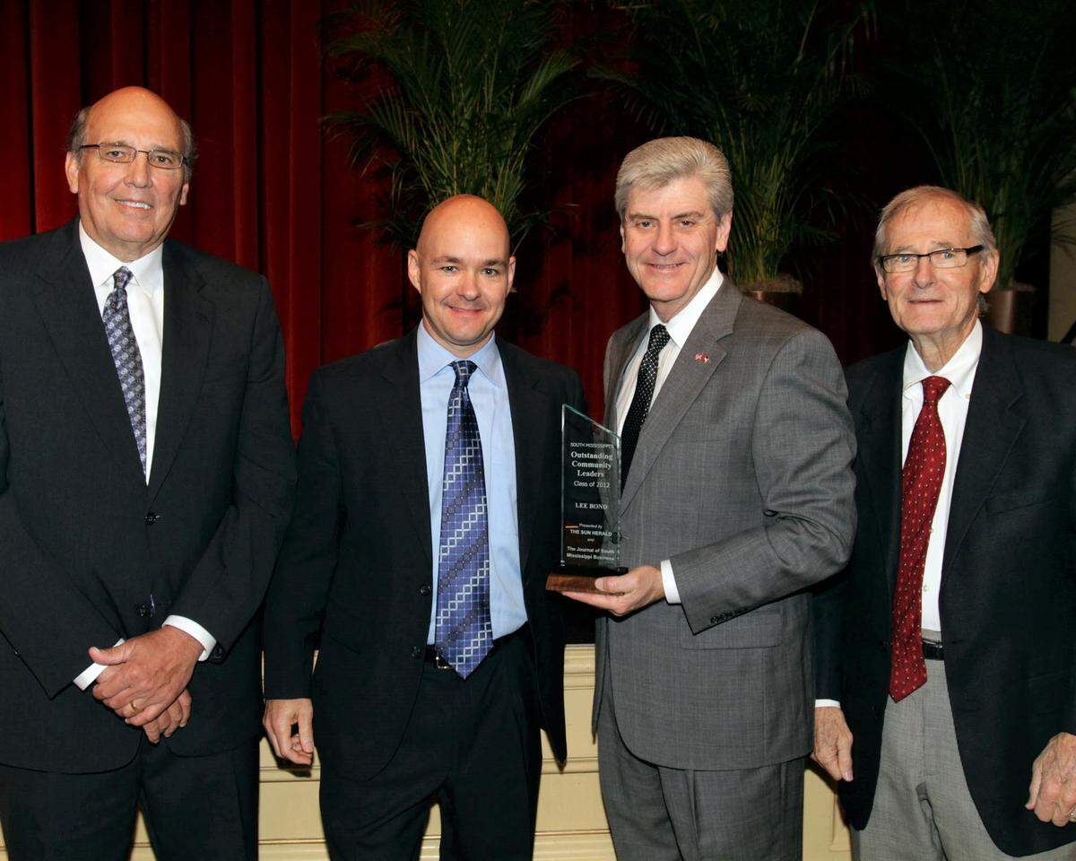 Lee Bond, second from left, is presented with the Outstanding Community Leader Award by former Sun Herald Publisher Glen Nardi, former Gov. Phil Bryant and former Sun Herald publisher Roland Weeks on April 10, 2013. The same year he changed careers from the casino industry to the medical field. He’s about to make another change.