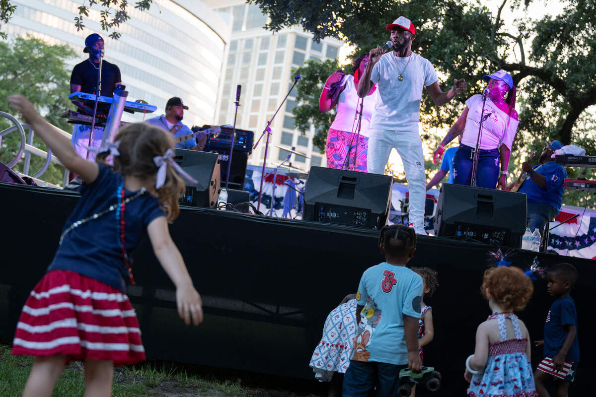 Children dance as Unfazed Show & Music performs during a Fourth of July at the Biloxi Town Green on Saturday, July 4, 2026.