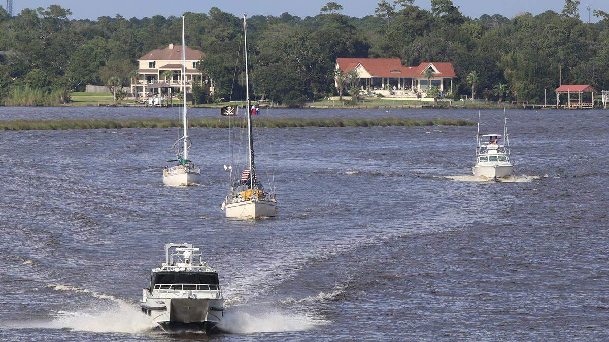 Boats make their way across Biloxi Back Bay as they evacuate to safe harbor on Monday, Sept. 3, 2018. Tropical Storm Gordon is expected to make landfall in Mississippi on Tuesday, Sept. 4, possible as a category 1 hurricane.