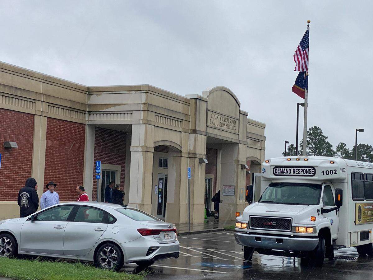 Buses to arrive at the County Farm Shelter in Harrison County on Wednesday afternoon. Red Cross volunteers are running the shelter and Harrison County Sheriff deputies are on hand for added security.