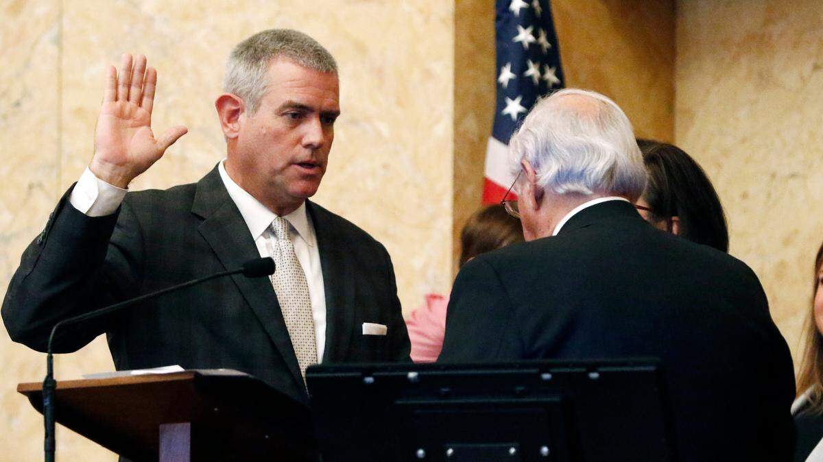 Rep. Philip Gunn, R-Clinton, recites his oath of office as Speaker as interim Speaker John O. Read, R-Gautier, right, presides in the Mississippi House, Tuesday, Jan. 7, 2020, in Jackson, Miss. Gunn was reelected speaker during early action on the opening day of the legislative session.