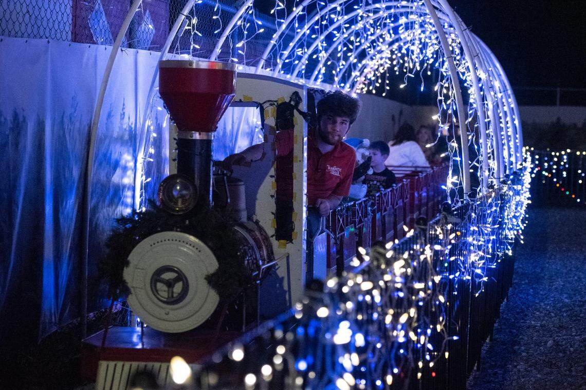 Families ride the outdoor train during a preview night for TrainTastic’s Holiday Lights event at TrainTastic Interactive Model Railroad Museum in Gulfport on Wednesday, Dec. 4, 2024.