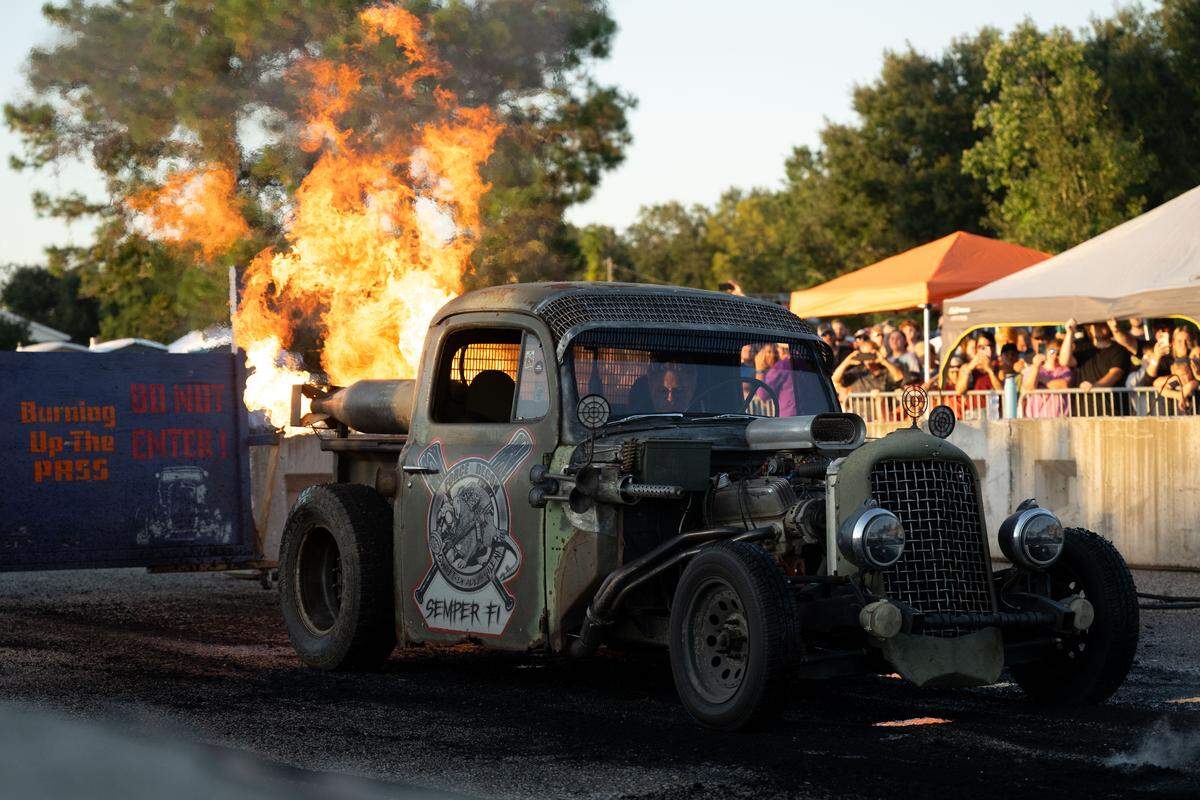 A modified vehicle shoots out fire during Burn ‘Em Up In The Pass on Thursday, Oct. 9, 2025.