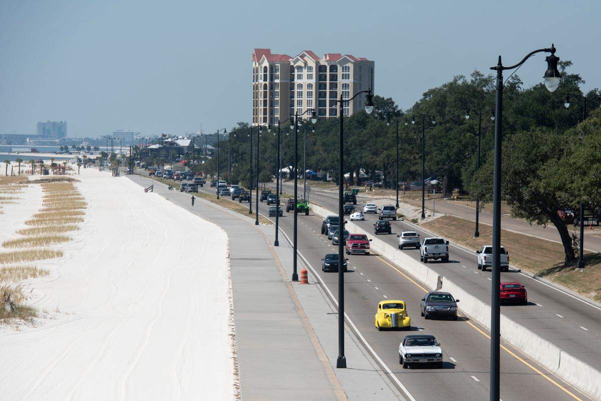 Cruisers drive down Highway 90 in Gulfport during Cruisin’ the Coast 2022. 