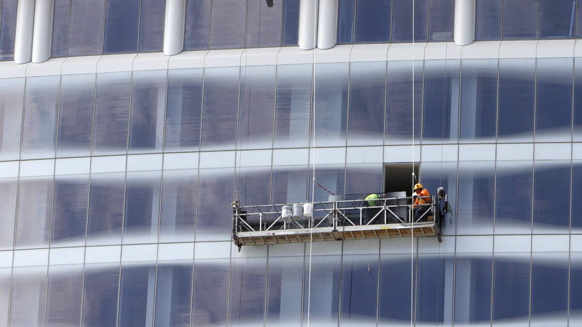 TIM ISBELL/SUN HERALDA crew works on windows at the Scarlet Pearl Casino in D'Iberville on Wednesday.