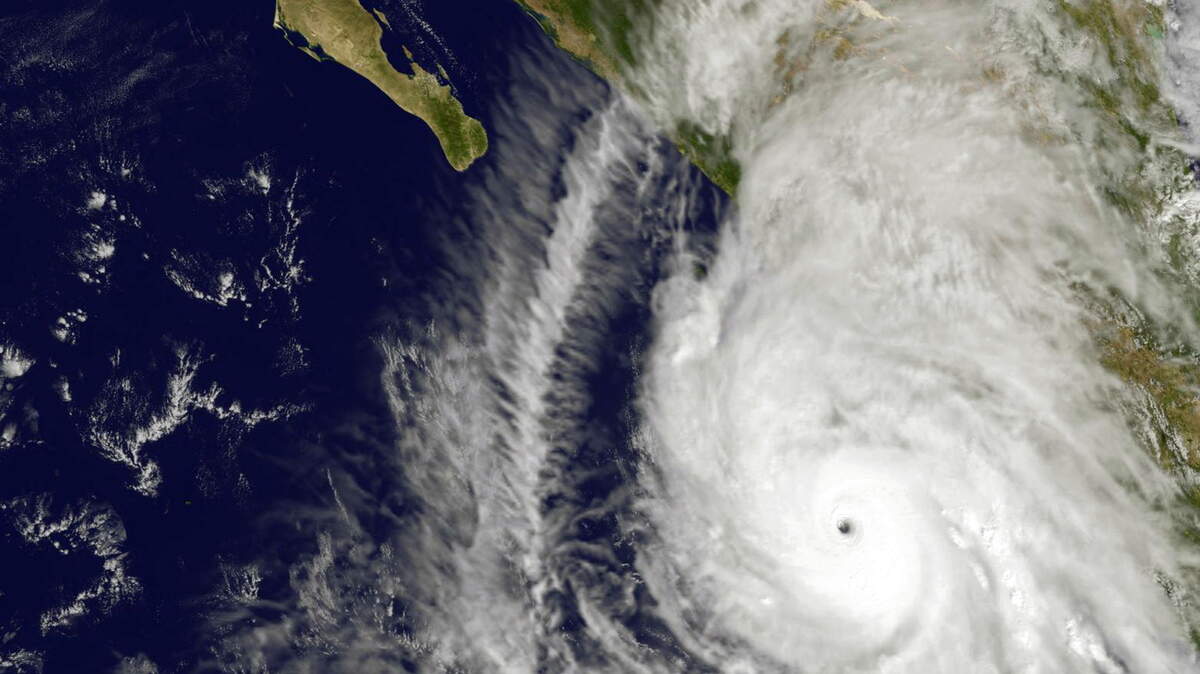 This satellite image taken at 1:45 p.m. EDT on Friday, Oct. 23, 2015, and released by NASA, shows the eastern quadrant and pinhole eye of Hurricane Patricia moving towards southwestern Mexico. The Category 5 storm is strongest ever in the Western Hemisphere, according to forecasters. (NOAA GOES Project/NASA via AP)