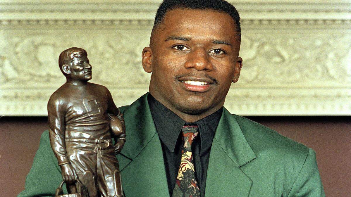 DAVID KOHL/ASSOCIATED PRESS 
 Florida State football player Terrell Buckley poses with his Jim Thorpe award in King's Mill, Ohio, Dec. 7, 1991.