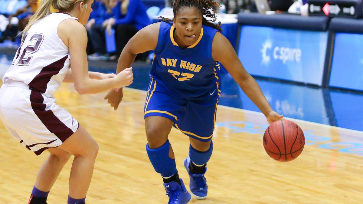 BOB SMITH/SPECIAL TO THE SUN HERALD 
 Bay High's Jamaya Galloway (22) drives against New Albany during MHSAA Girls State Basketball Tournament quarterfinal action held in Jackson at the Mississippi Coliseum.