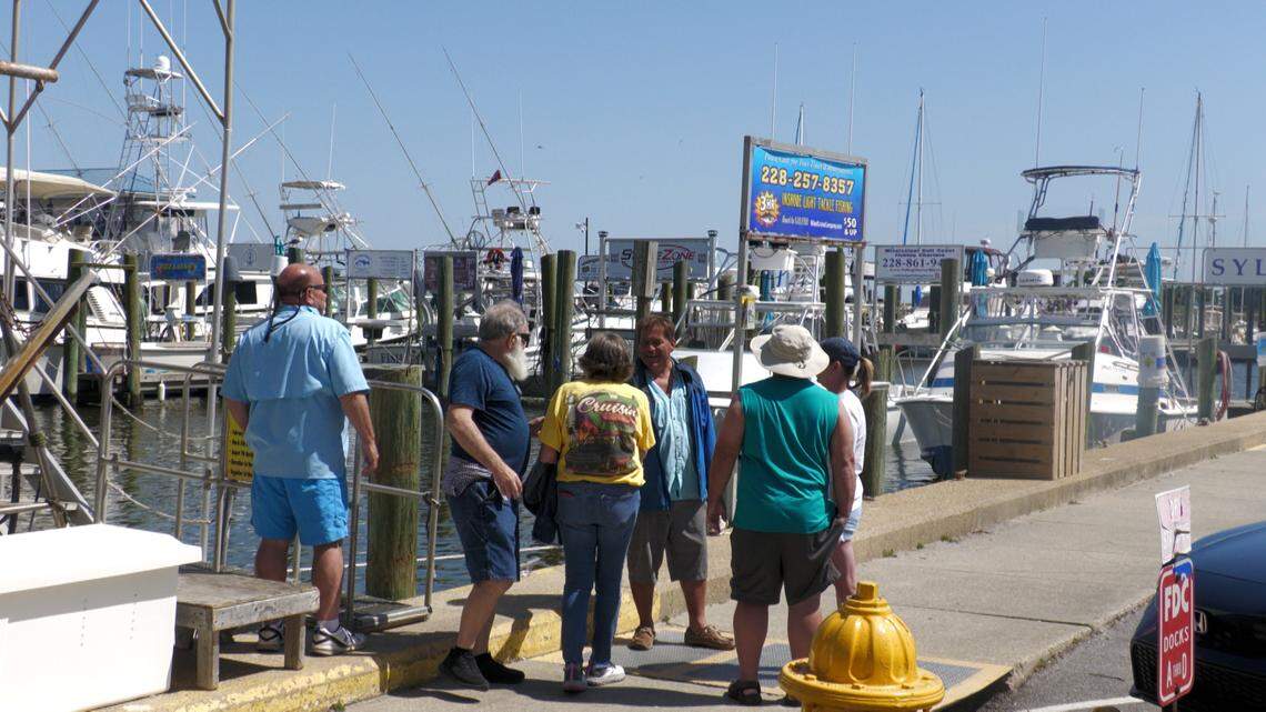 A tour group gathers along the Biloxi harbor before setting out on a shrimping cruise. Local guides say trips like these offer both entertainment and education about Mississippi’s coastal industries.
