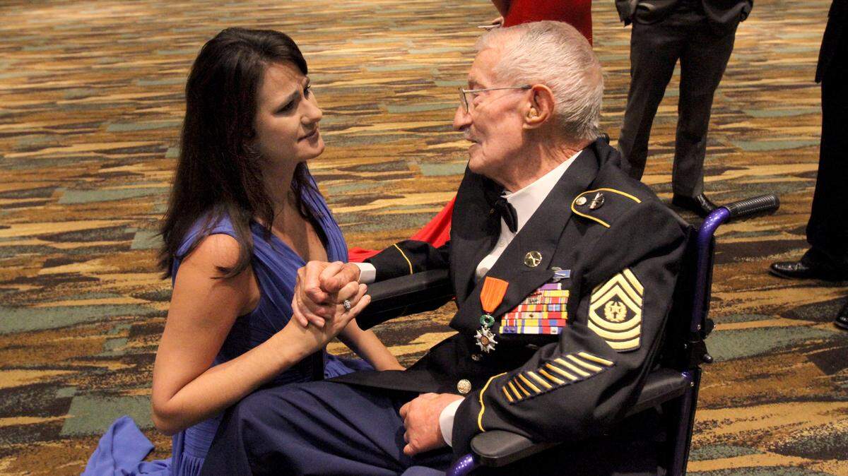 TIM ISBELL/SUN HERALD 
 Kim Ryan talks with Adelchi Pilutti prior to Salute to the Military in Biloxi, Tuesday, Oct. 20, 2015. Pilutti is a World War II and D-Day veteran.
