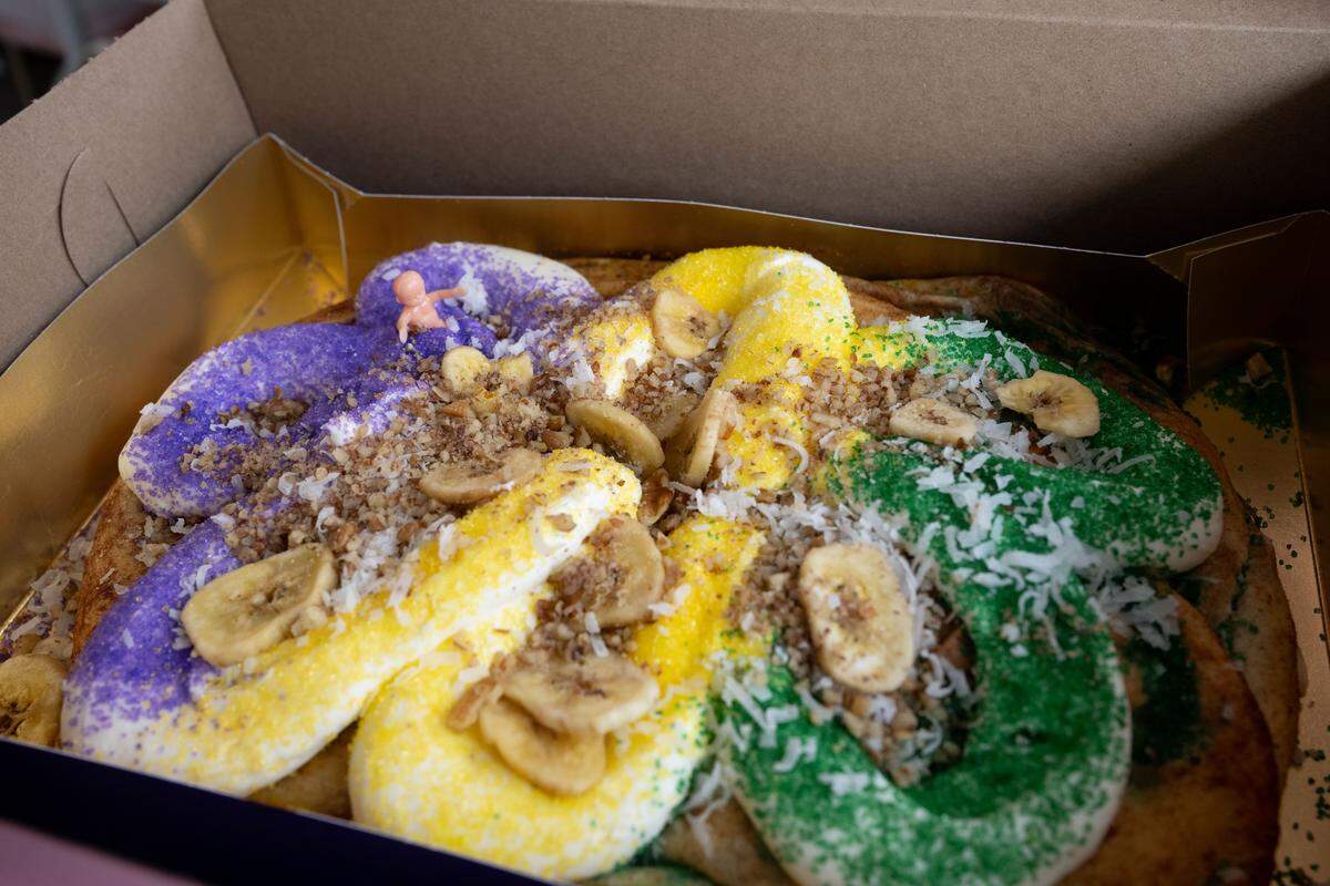 A hummingbird king cake featuring banana, coconut, pineapple and pecans is one of the limited edition cakes at Dolce Bake Shop in Long Beach.