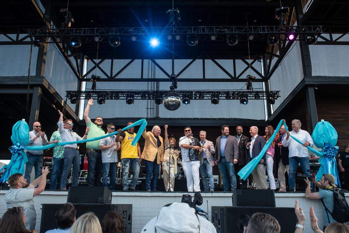 City leaders from several Coast communities help Gautier Mayor Casey Vaughn and Gautier City Manager Paula Yancy cut the ribbon before the inaugural show at The Sound Amphitheater in Gautier on Friday, April 12, 2024.