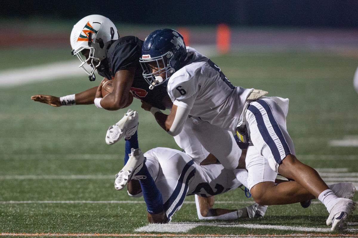 West Harrison Hurricanes’ Trey Harris gets tackled during a game against Moss Point at West Harrison High School in Gulfport on Friday, Sept. 22, 2023.