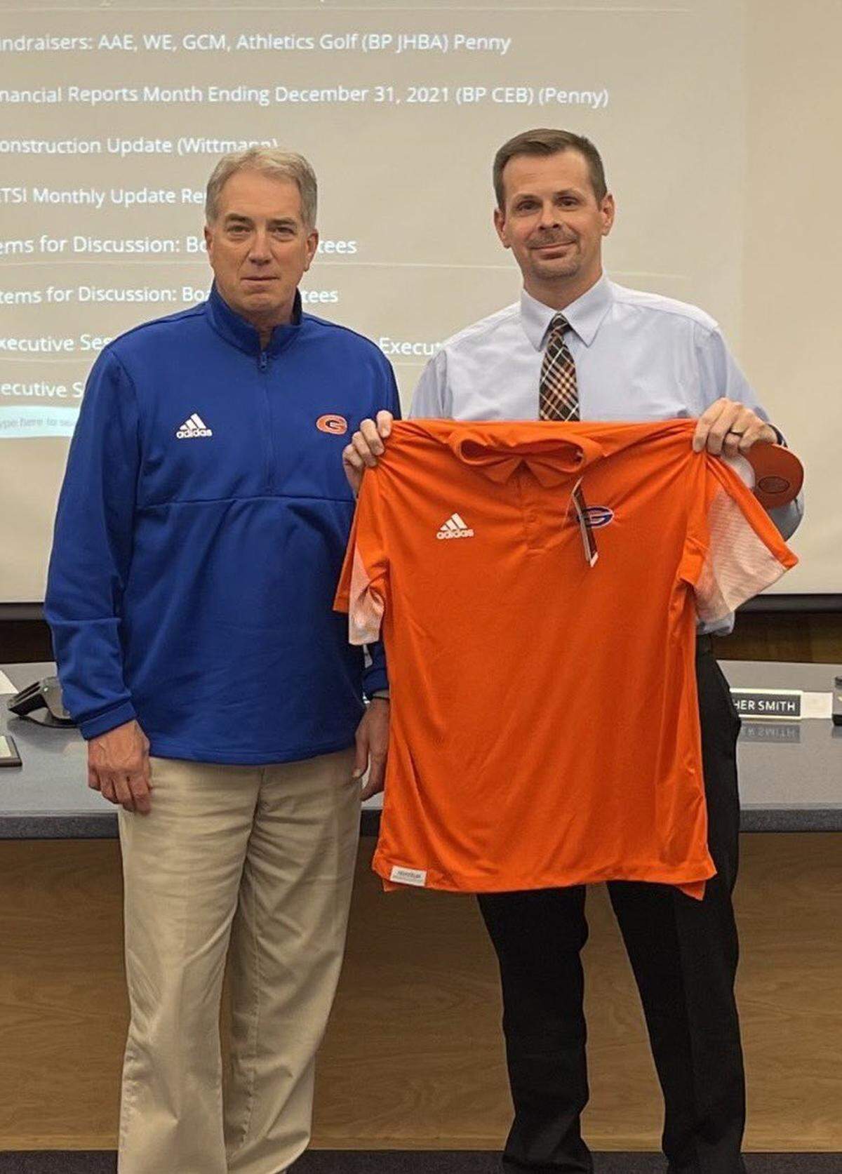 Incoming Gulfport athletic director Matt Walters with outgoing Bryan Caldwell