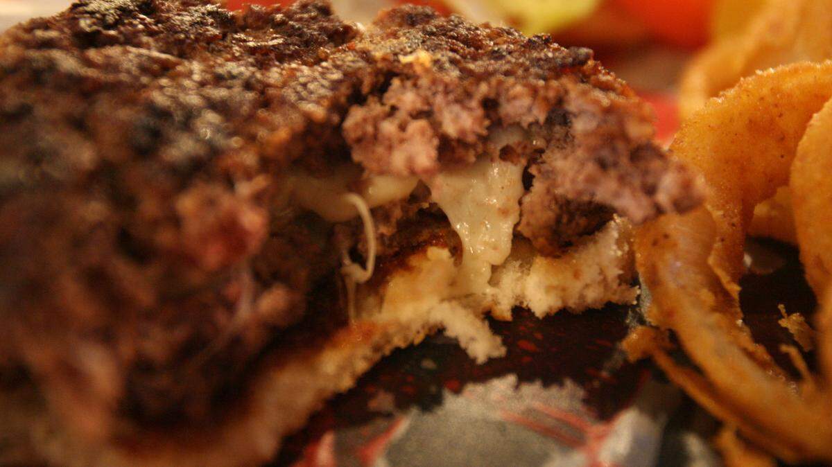 JUSTIN MITCHELL/SUN HERALDThe stuffed cheeseburger at Sideways sports bar is hand-rolled and filled with mozzarella cheese.