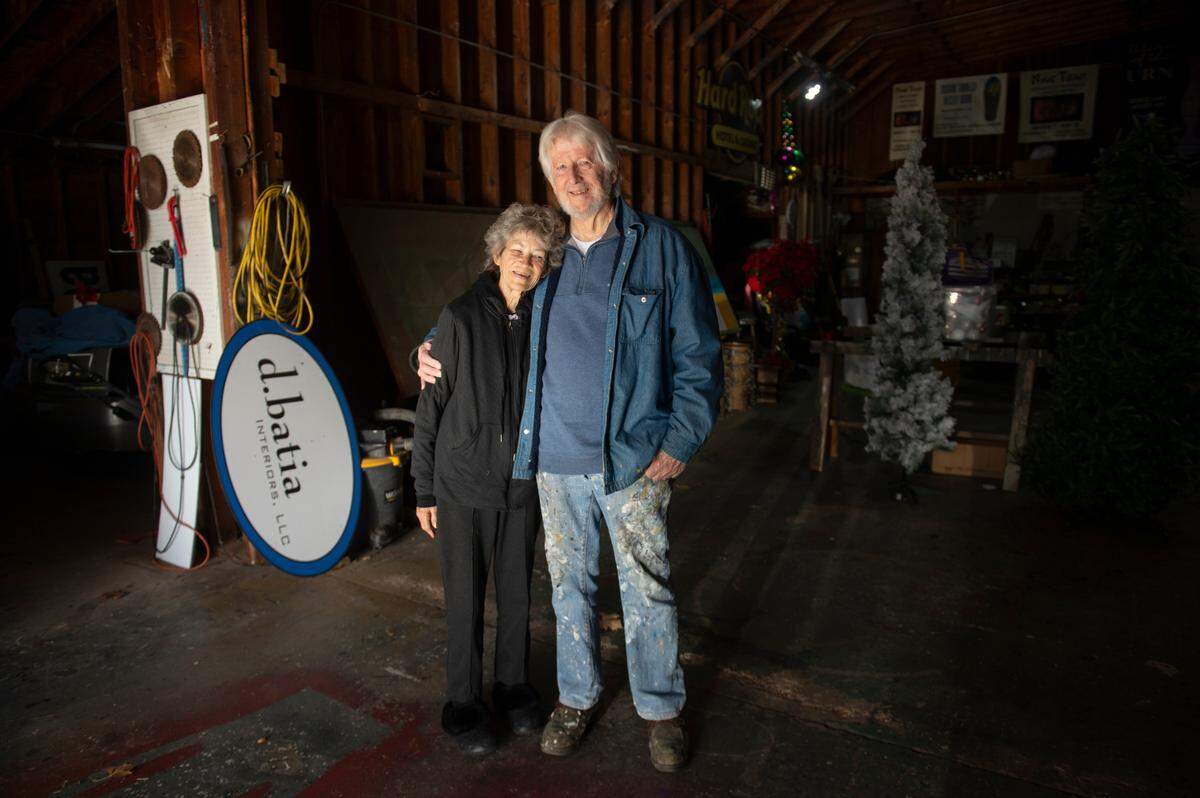 Doug Blom and his wife Jan pose for a portrait at their sign shop in Biloxi on Wednesday, Jan. 10, 2024. The Bloms have been designing, building and decorating floats in Biloxi for decades.