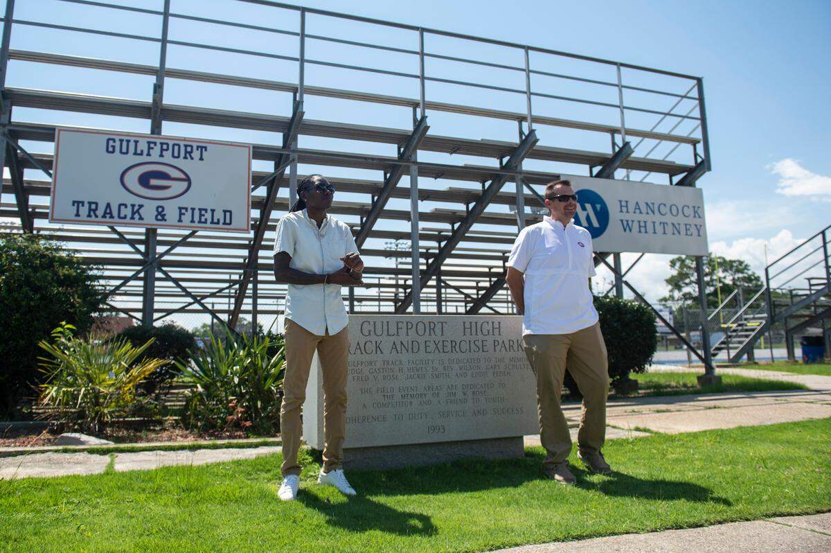 Olympian Brittney Reese, left, stands with Gulfport Athletic Director Matt Walters outside the Gulfport High School Track and Exercise Park to announce Reese’s new position as head track and field coach at the high school on Monday, July 11, 2022.
