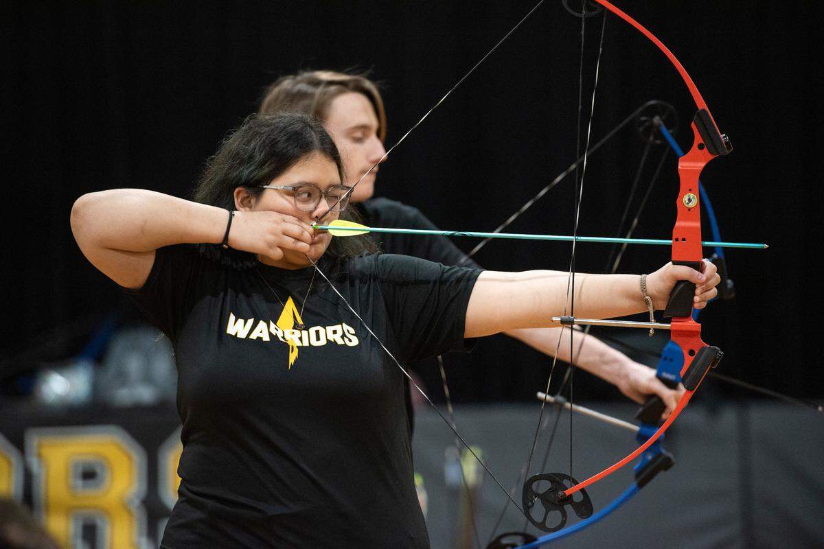 The D’Iberville High School archery team practices in the gym at D’Iberville High School on Thursday, April 18, 2024.