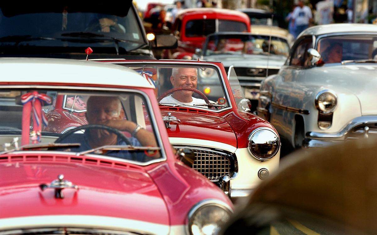 Metropolitan Nash owners Jerry Guillot, of Ponchatoula, La, left front, and Walter Perez, of Robert, La, center, wait in traffic on Main Street in Bay St. Louis in 2002. The event continues to grow with 2018 setting new registration records again.