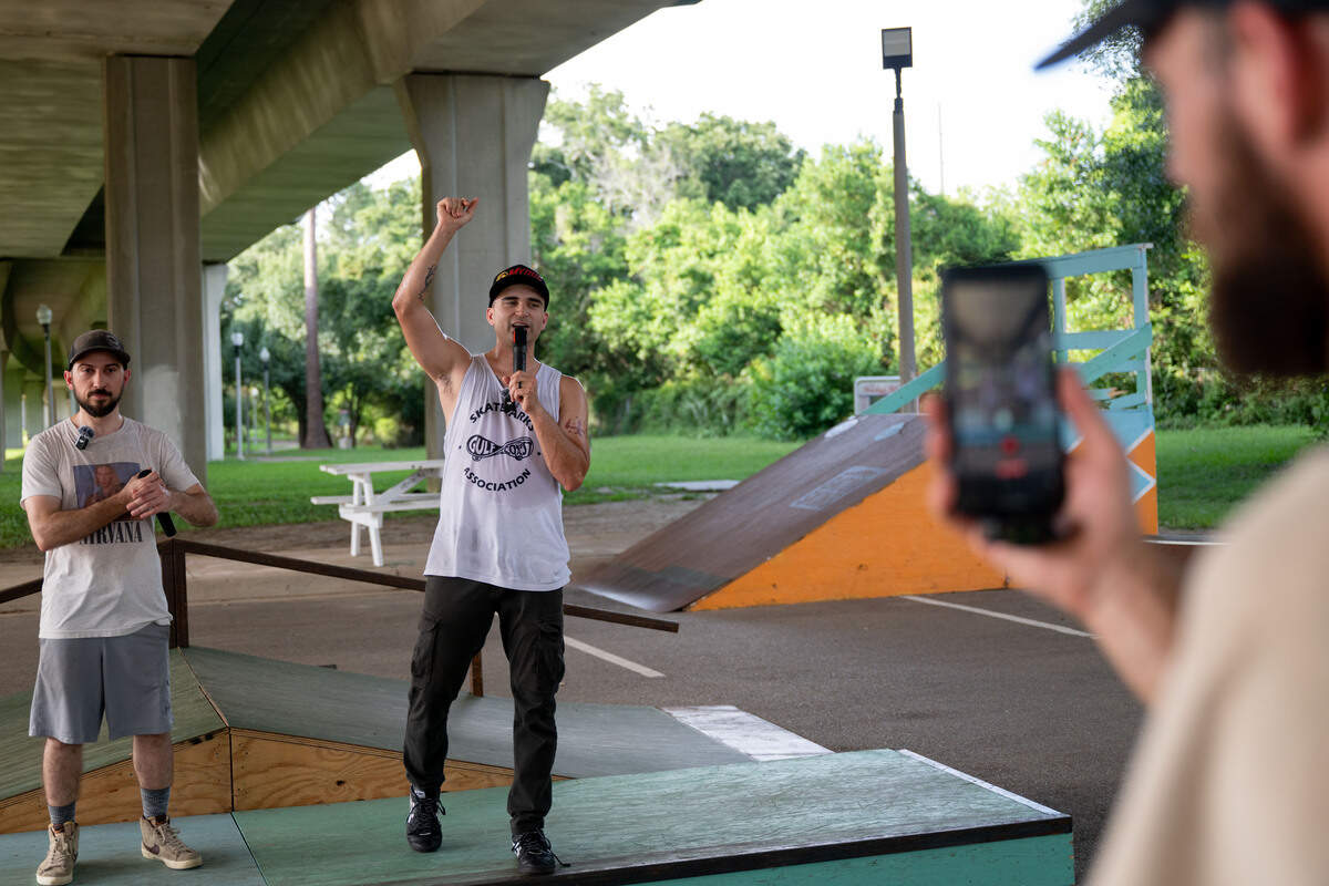 Tyler Prowant, middle, gives a speech to other skaters July 8 at the Biloxi DIY Skatepark.