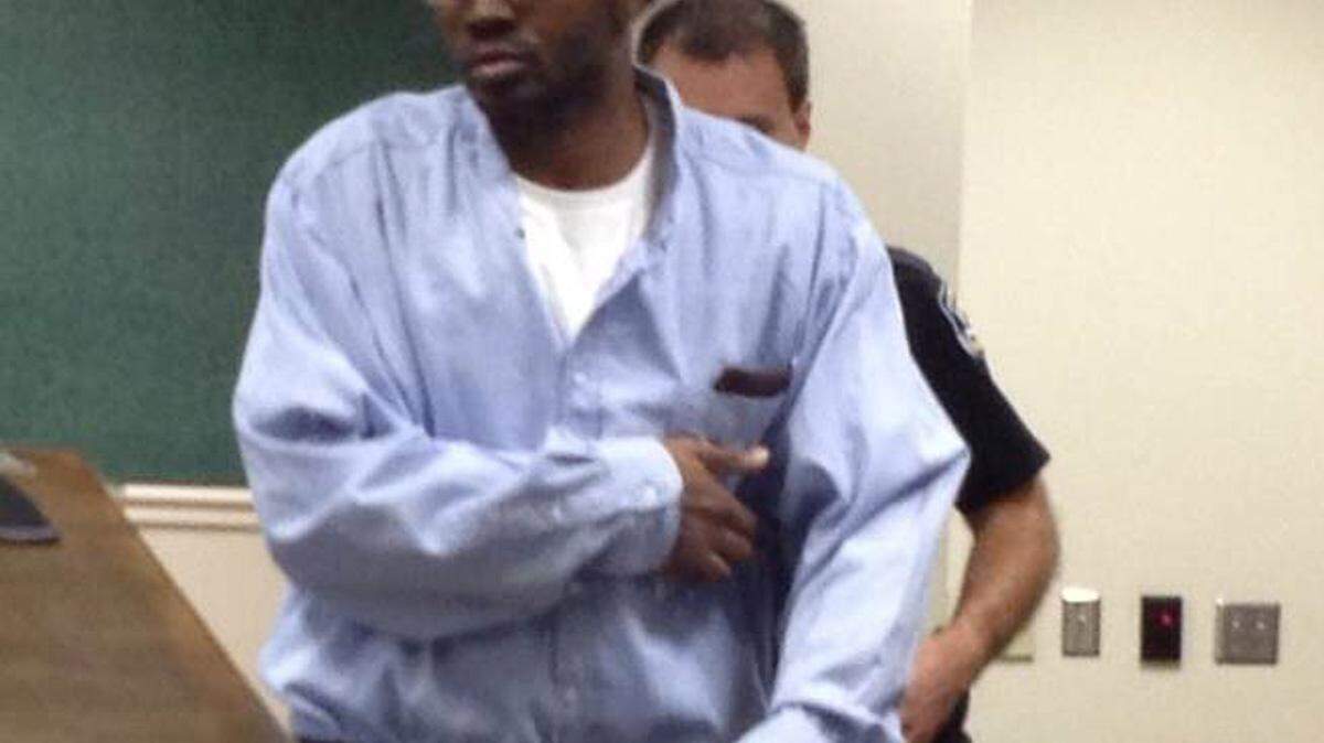 TAMMY LEYTHAM/SUN HERALDAdrian Moore walks into a Jackson County courtroom in 2014 before he is found guilty of murder and aggravated assault. He was convicted of killing one man and wounding another in a shooting in 2013.