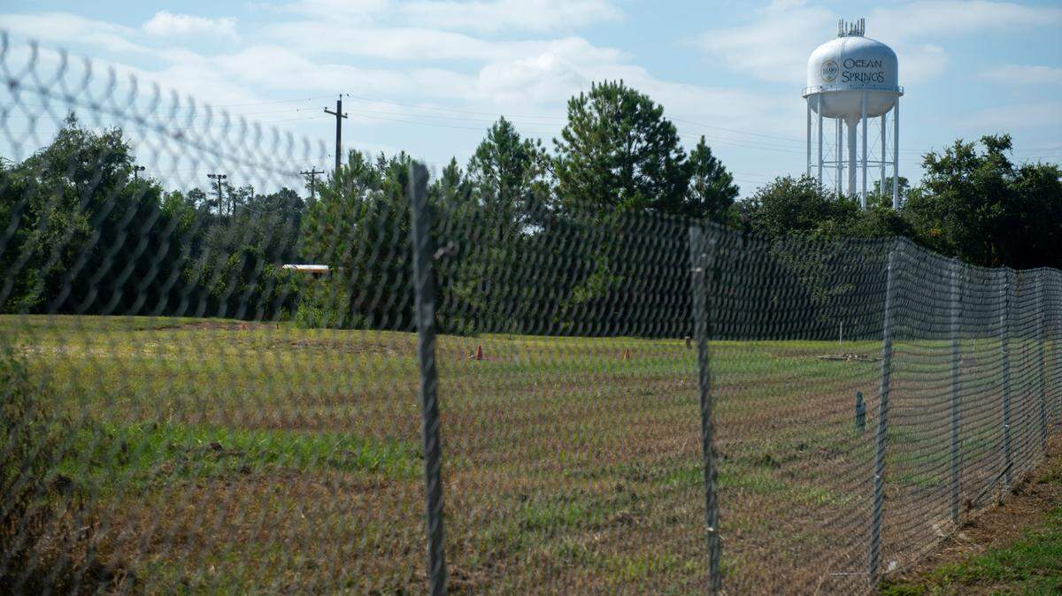 The site of a former optics manufacturing plant at the corner of Government Street and Pine Drive in Ocean Springs on Friday, Aug. 23, 2024. A hotel operator who owes outstanding debts in Alabama is being courted by Ocean Springs to develop the property.