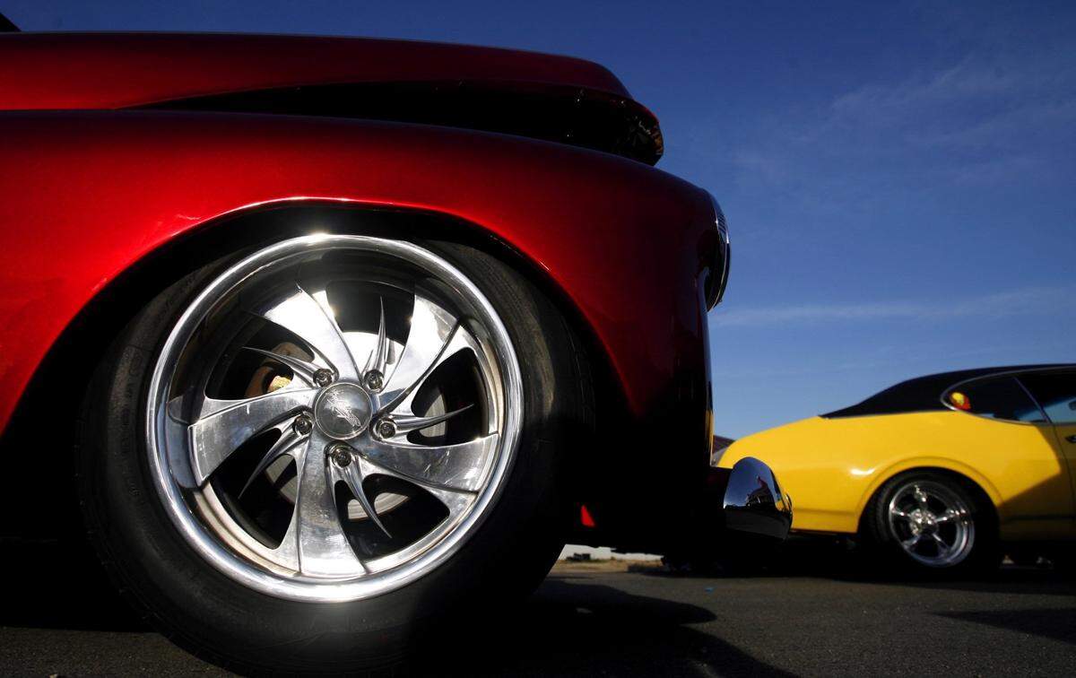 A red 1942 Chevy’s rims gleam as the sun sinks farther into the horizon before the Cruisin’ the Coast kick-off parade in Long Beach on Monday, October 1 2007.