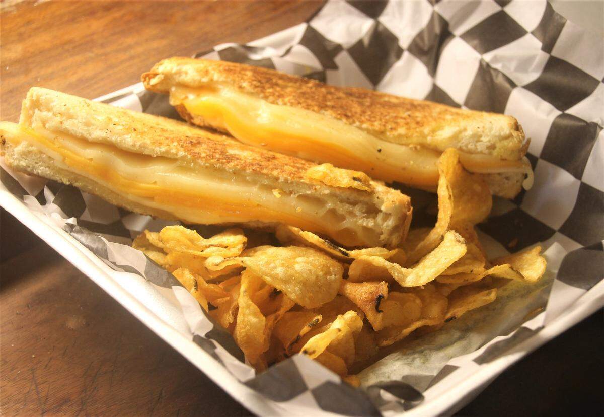 Sip Beverages in Biloxi has a grilled cheese sandwich that is served with chips or potato salad.
