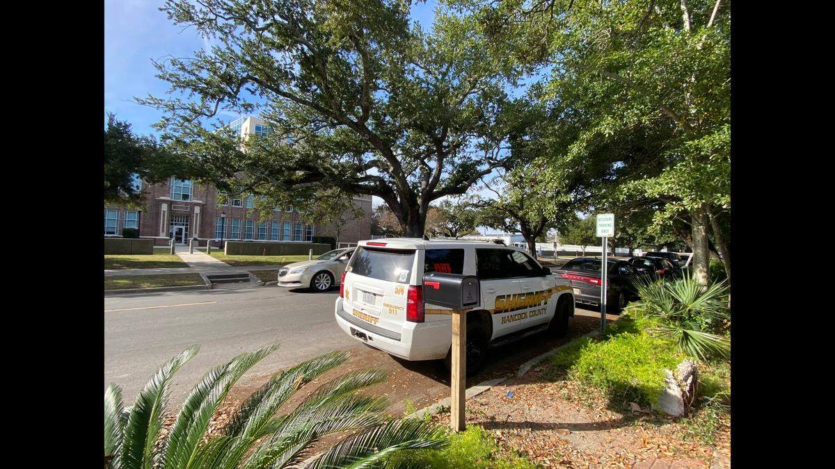 A Hancock County Sheriff’s Department SUV is parked outside the federal courthouse in Gulfport on Wednesday, Nov. 29, 2023, after deputies arrive to provide grand jury testimony in a fatal police shooting.