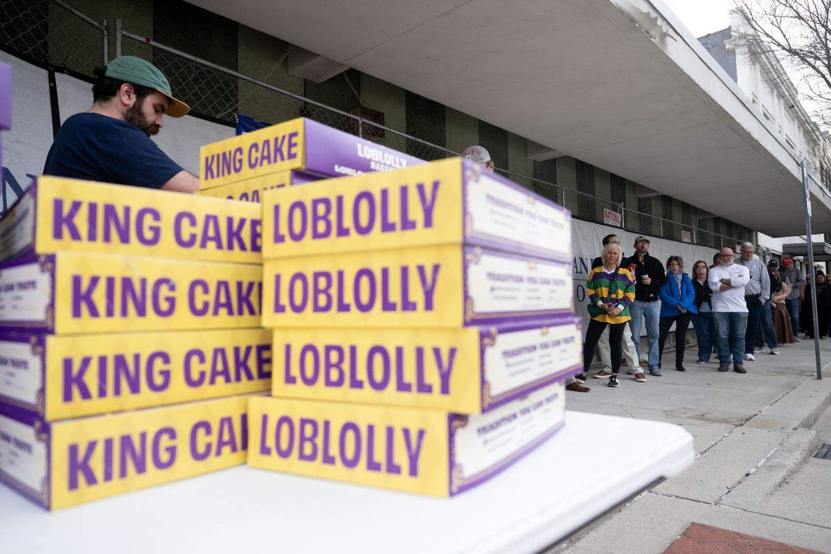 Stacks of Loblolly Bakery king cakes await as people get in line during a king cake pop-up sale hosted by Loblolly Bakery on Wednesday, Jan. 21, 2026. More cakes will be available at the next sale on Jan. 31.