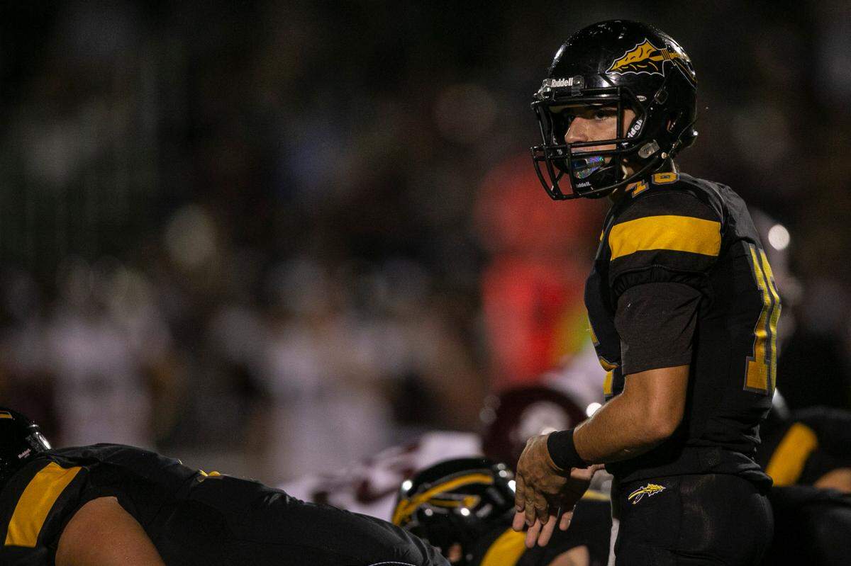 D’Iberville quarterback Lance Garlotte prepares for the snap during the D’Iberville versus Picayune game at D’Iberville Stadium on Friday, Sept. 17, 2021.