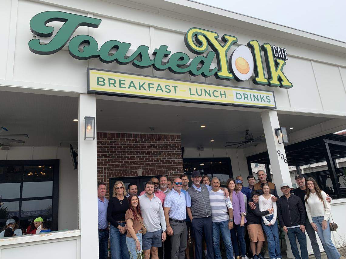 John Boothby, center, is surrounded by family and friends after he pulled off another big tip holiday breakfast Saturday, Jan. 3, despite fighting cancer. Two waitresses shared the tip of a lifetime from the group at Toasted Yolk Cafe in Biloxi.