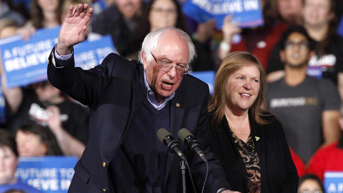 Democratic presidential candidate Sen. Bernie Sanders, I-Vt., with his wife Jane Sanders, waves as they arrive to a primary night rally in Essex Junction, Vt., Tuesday, March 1, 2016, on Super Tuesday. (AP Photo/Jacquelyn Martin)