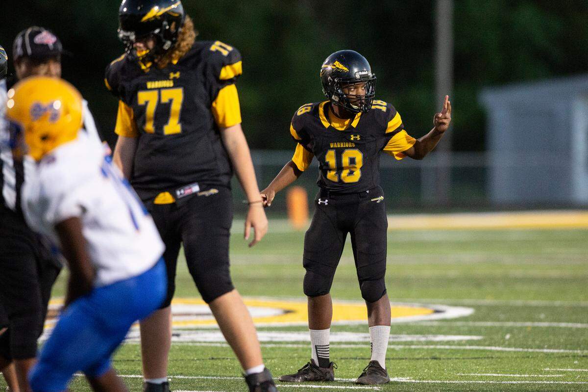 Tyler Hunter, the student manager for D’Iberville’s JV football team, signals to his coaches during a game against St. Martin at Warrior Stadium in D’Iberville on Monday, Oct. 9, 2023. Hunter, who has an intellectual disability, played for two of the game’s plays, scoring two touchdowns.