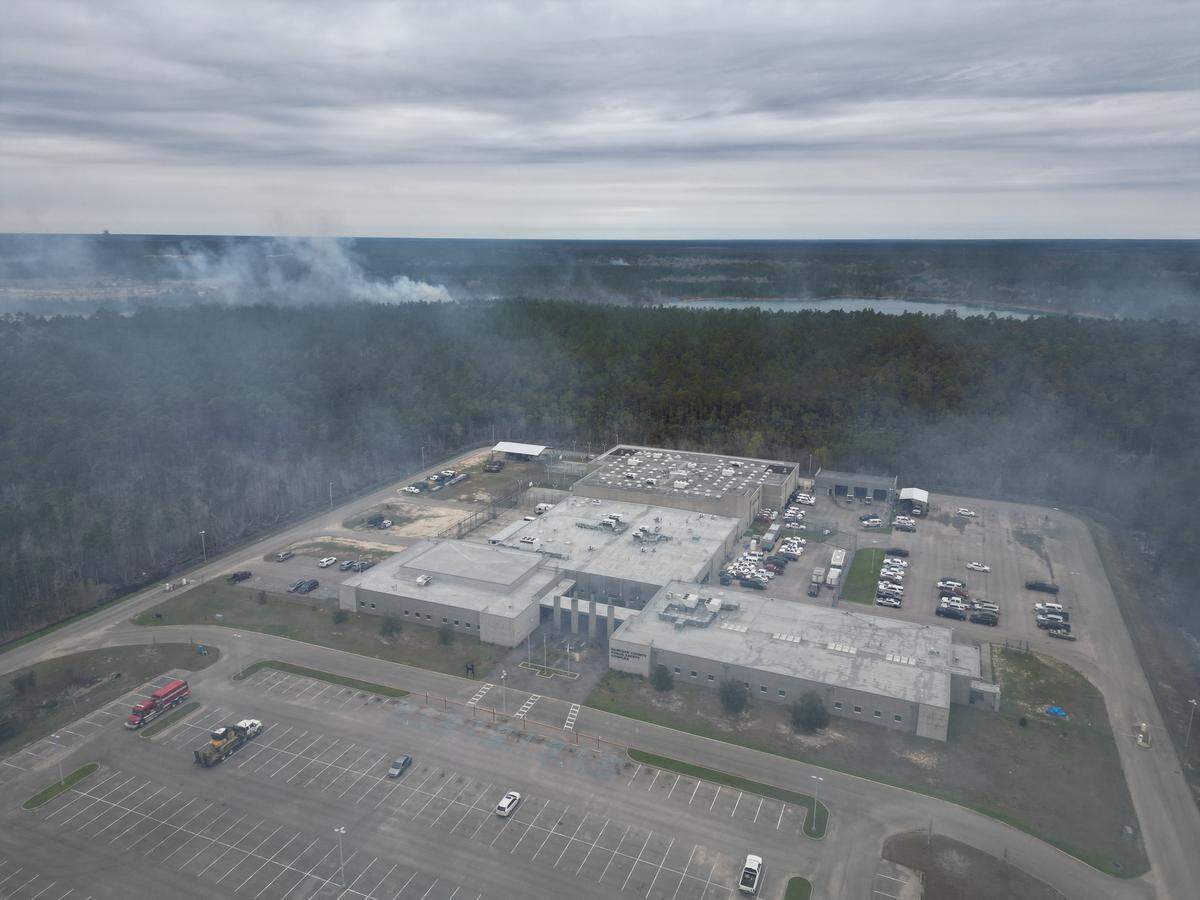 A drone photo from the Hancock County Sheriff’s Office shows a wildfire burning near Highway 90 and the Hancock County Public Safety Complex, which houses the jail, on Feb. 29, 2024. According to officials around 400 acres have burned in the fire.