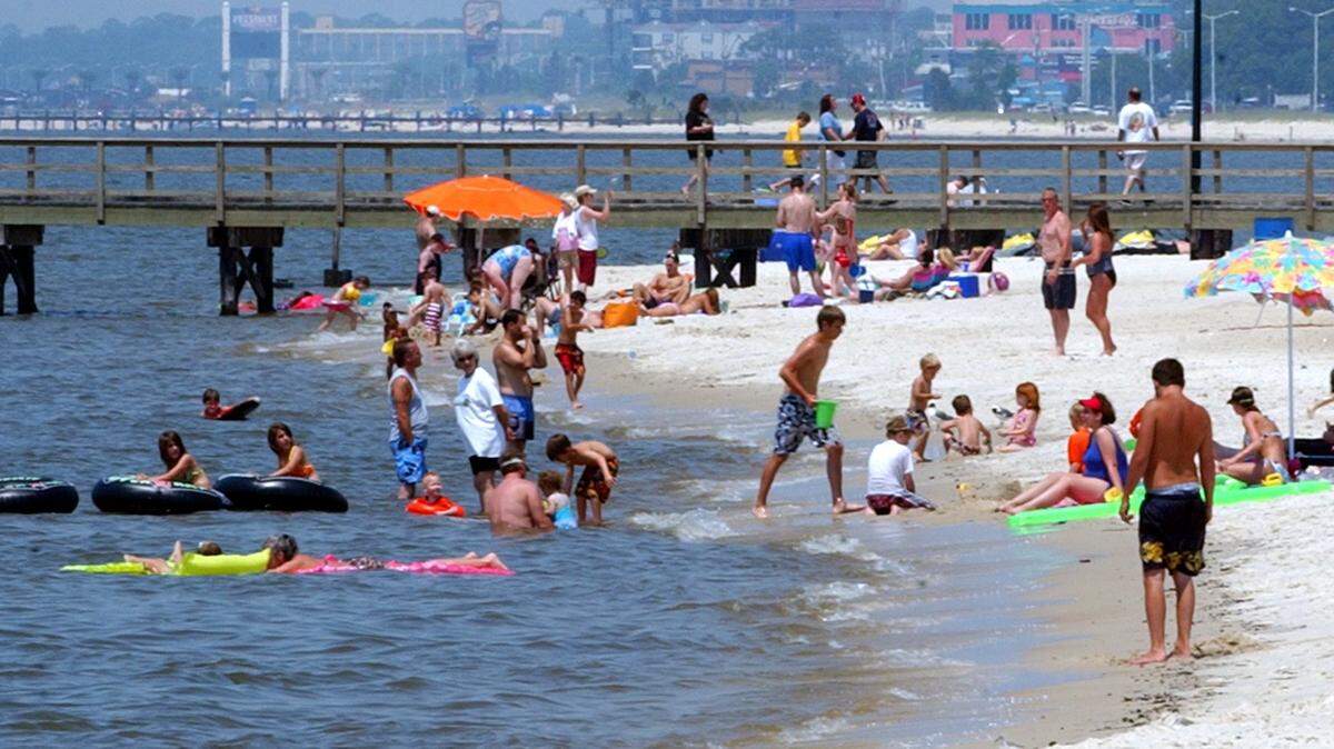People enjoy the beach in Biloxi in 2005.